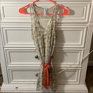 Cream paisley dress and coral waist wrap